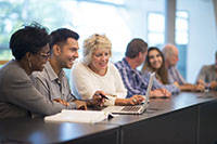 MBA students at a table together